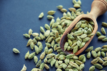 Super food cardamom health food selection in spoon.