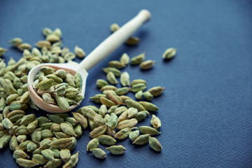 Super food cardamom health food selection in spoon.