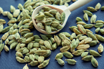 Super food cardamom health food selection in spoon.