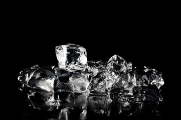 Fresh ice cubes melting on the dark background