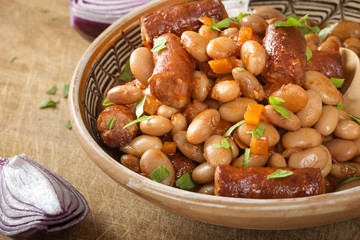 Beans stew wit pork sausages and tomato sauce