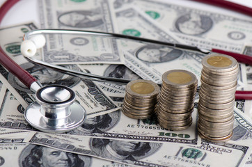 Stethoscope on money background Financial Health Investment Concepts
