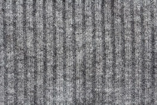 Knitted gray fabric texture, elastic melange, background Stock Photo