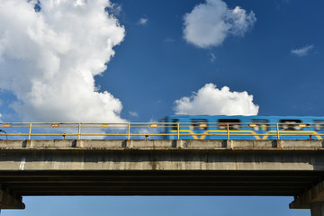 Obraz premium metro train speeding by bridge