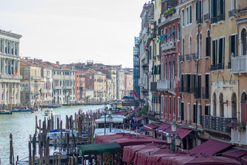 Fototapeta na wymiar View of canal grande seen from the rialto Bridge, docked boats and architecture in Venice Italy 