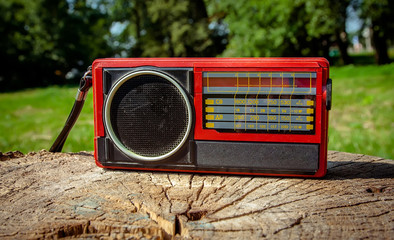 Old Soviet radio on a wooden background.