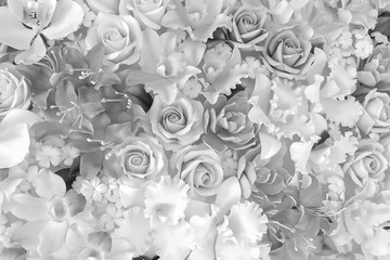 Artistic Background of Artificial Plastic Flowers in black and white photography.Artificial flowers are imitations of natural plants normally used for commercial and residential decoration.