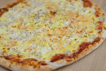 Pizza time on light wooden table background