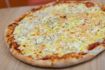 Pizza time on light wooden table background