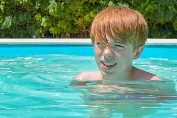 Teenage boy in swimming pool © lightspireuk
