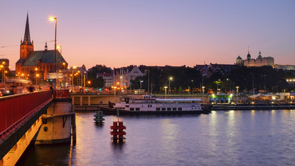 Naklejka na ściany i meble Szczecin. night view of the river and coastal boulevards.