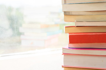 Pile of books on blur background