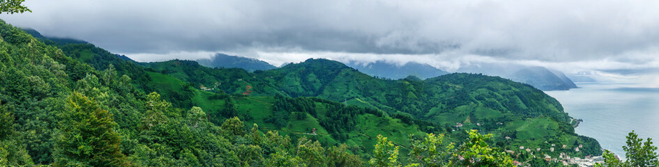 Fototapeta premium Panoramic panorama view of the mountains and sea in Georgia summer Kvariati Sarpi border with Turkey