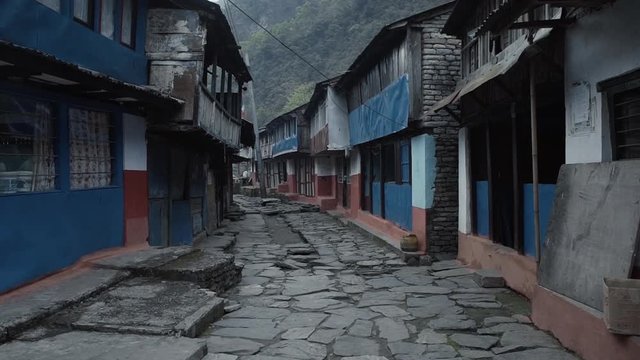 POV walking down the path of a small town in the Annapurna region of Nepal.
