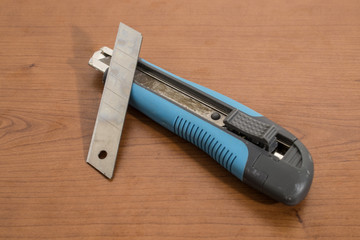 Blue cutter and accessories on a wood table