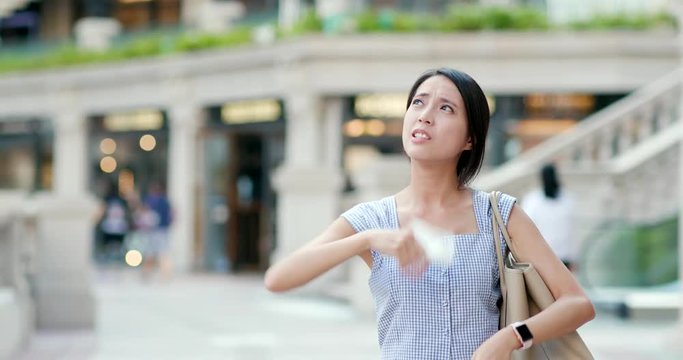 Woman feeling so hot in the street