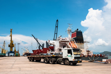sea port terminal where both tranports meet together of sea ship and trailers trucking cargo delivery shipment from loading port to discharging destination port services to Worldwide logistics system