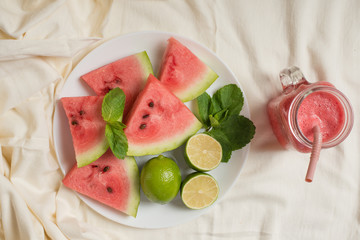 Watermelon puree against a bed background, healthy drink. Summer. Watermelon slices.