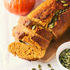 Homemade pumpkin loaf cake on white background.