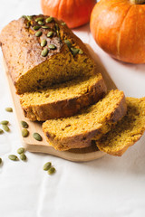 Homemade pumpkin loaf cake on white background.