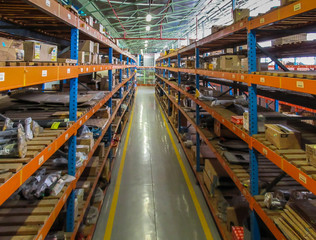 Fototapeta premium Warehouse store aisle with stacked shelving