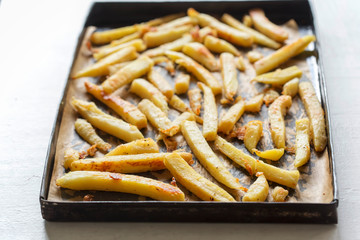 Roasted parsnip with parmesan on baking tray
