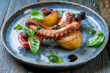 grilled octopus on plate © bbivirys