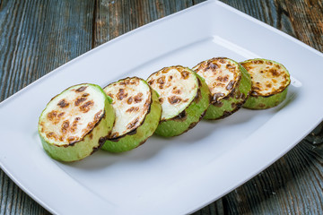 Sliced fried young courgettes