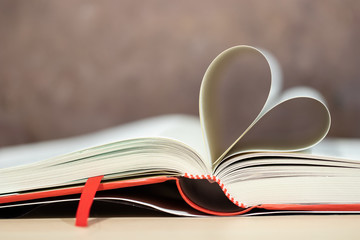 Naklejka premium A book is a series of pages assembled for easy portability and reading, as well as the composition contained in it.
