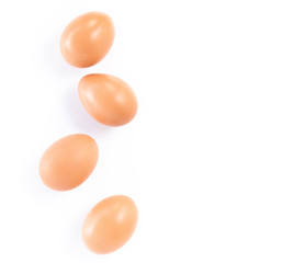 Closeup top view raw chicken eggs isolated on white background with copy space