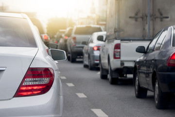 Cars on the road heading towards the goal of the trip.and stop by traffic jam in junction in Thailand.