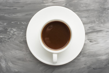 Black coffee on a dark texture
