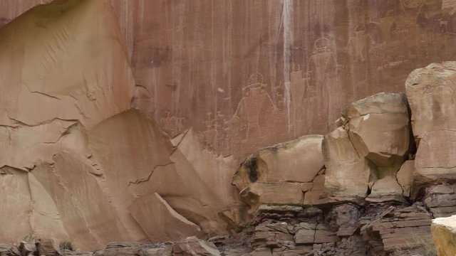 Native American Petroglyphs on red rock inside of the Capital Reef National Park in Southern Utah, USA.