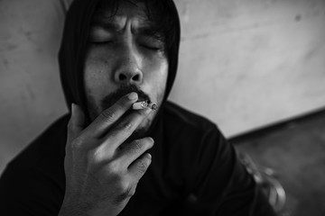 The man is smoking and symptoms of depression