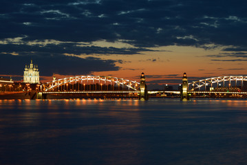 Fototapeta na wymiar June sunset at the Bolsheokhtinsky bridge. Evening St. Petersburg, Russia
