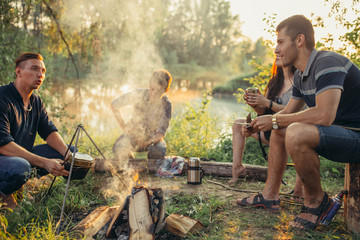 close friends are sharing secrets at campsite. close up photo