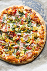 Pizza with chicken, bacon and vegetables 