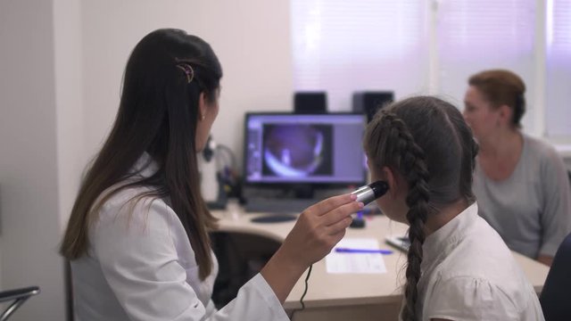Little girl checks the hearing