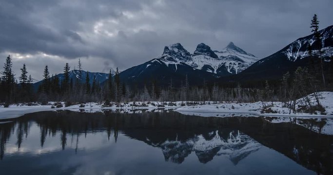 Gloomy day cloudscape time lapse of the Three Sisters Reflecting on the Water