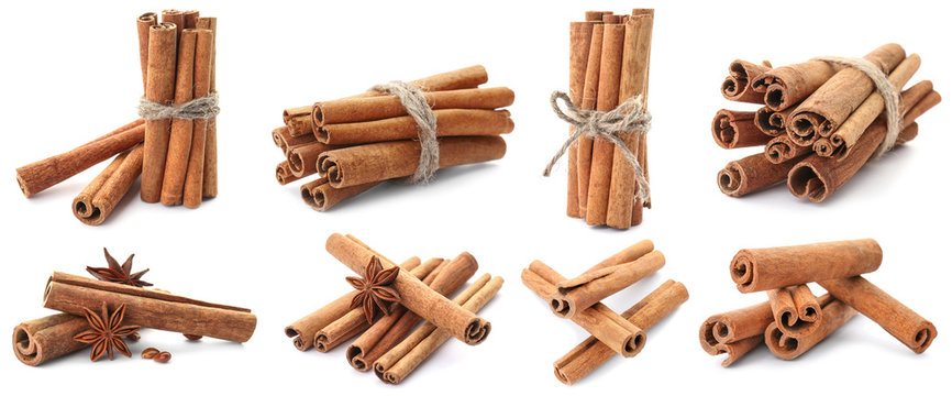 Set with aromatic cinnamon sticks on white background