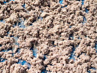 Sun dried shrimp paste or shrimp sauce. Local ingredient in south of Thailand. Salty taste.