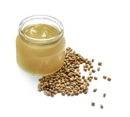 Jar with hemp lotion on white background