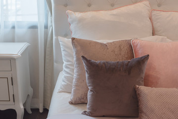 luxury suite bedroom with set of pink pillows