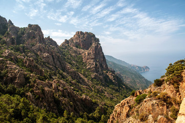 Evening view of the sun-lit mountains and sea, Corsica (region Calanche)