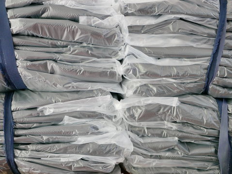 Stacks of clothes packed in plastic bags ready to be shipped / distributed