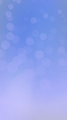 Blue-purple hue with abstract winter background, big and small bokeh circles