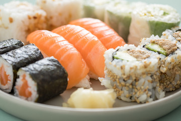 Salmon and tuna sushi mix plate with Nigiri, Maki and inside out California rolls 