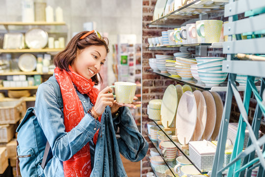 Asian Girl Shopping For Kitchenware In Retail Store