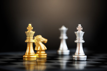 Close up chess pieces on chessboard with black background