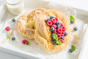 Delicious and tasty yeast cake with raspberries and blueberries